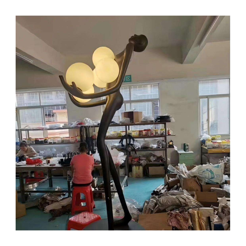 Reaching Orbs Figure Lamp